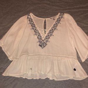 Lace up blouse with flower detail
